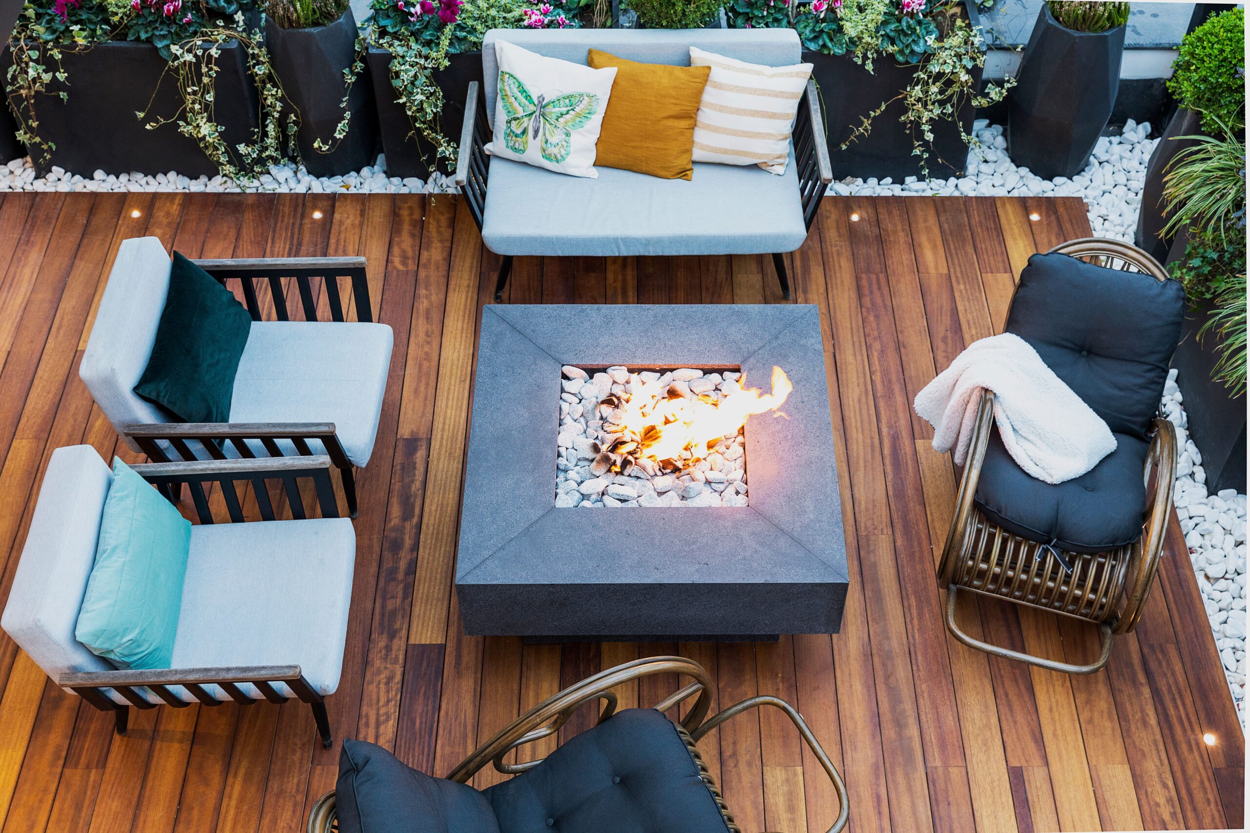 Outdoor fireplace with chimney on a stone patio